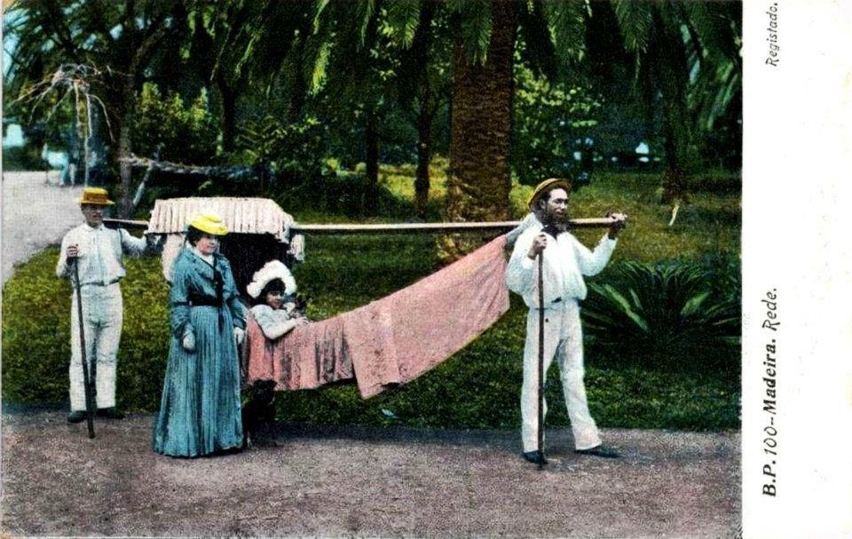 A girl and her chaperone with a hammock and two carriers in a Funchal garden, postcard circa 1900